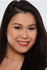 Portrait of a young smiling woman with long black hair